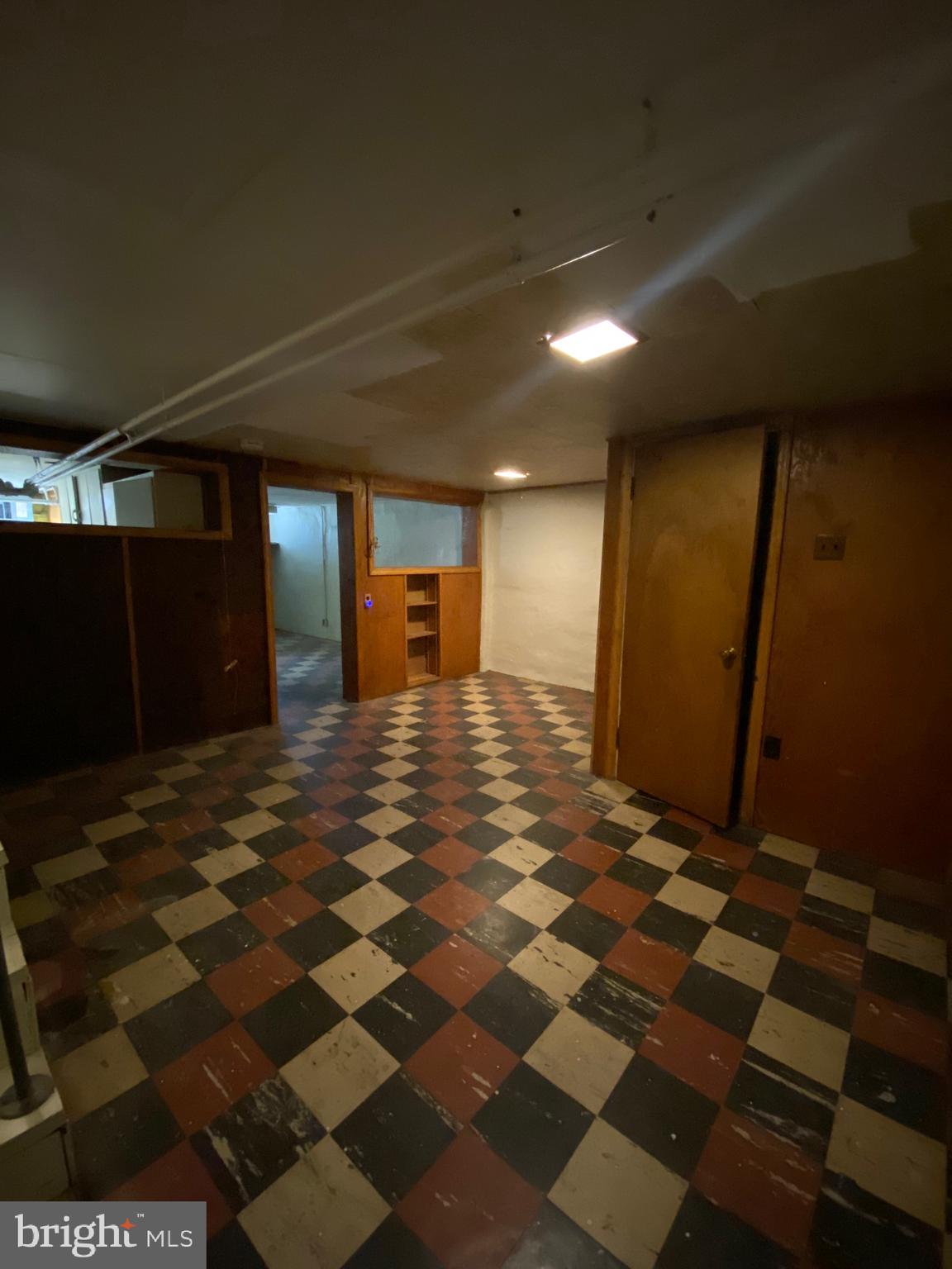 4010 Century Road Baltimore, MD 21206 - Photo 14 of 17 a bathroom with a black white checkered floor