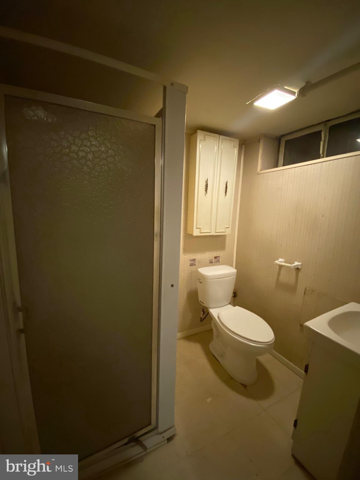 4010 Century Road Baltimore, MD 21206 - Photo 17 of 17 a bathroom with a toilet and a shower