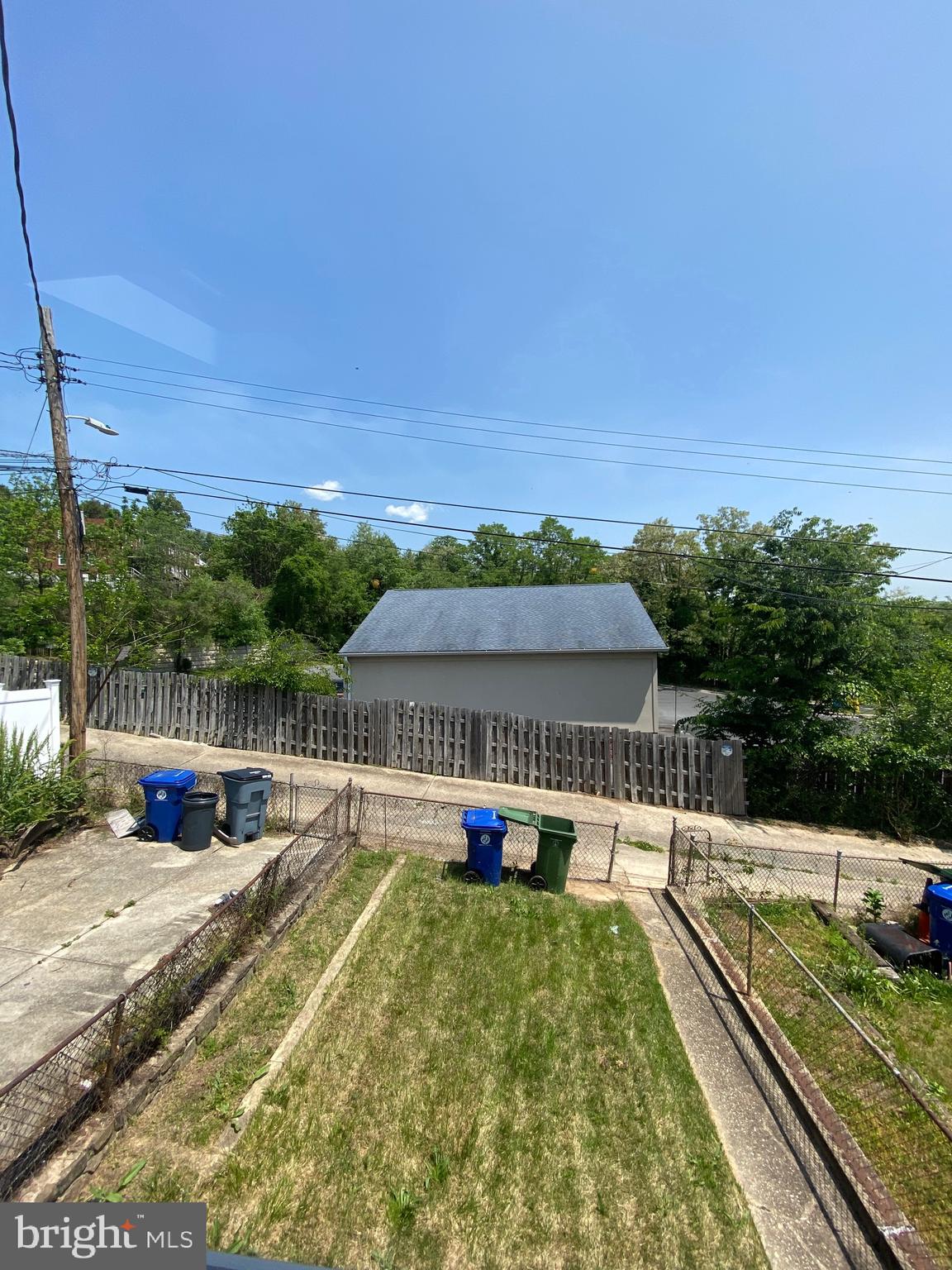 4010 Century Road Baltimore, MD 21206 - Photo 2 of 17 a view of a swimming pool with a patio and a yard