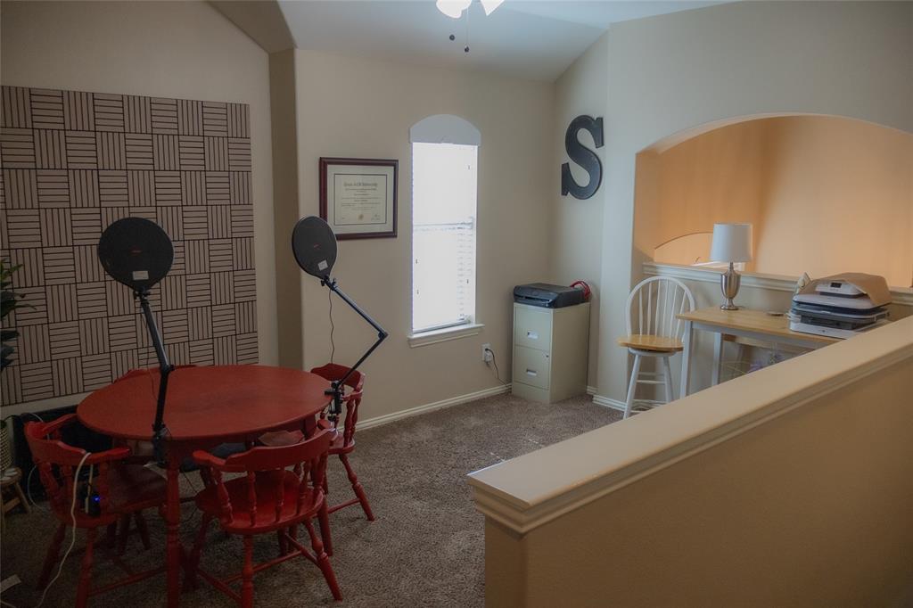 1395 Southern Rockwall, TX 75087 - Photo 13 of 22 a view of a dining room with furniture and wooden floor