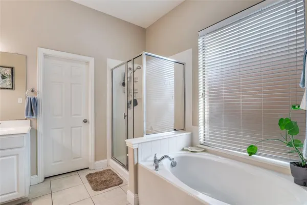 a bathroom with a sink double vanity and a mirror
