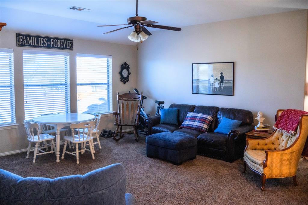 1395 Southern Rockwall, TX 75087 - Photo 15 of 22 a living room with furniture a window and a flat screen tv