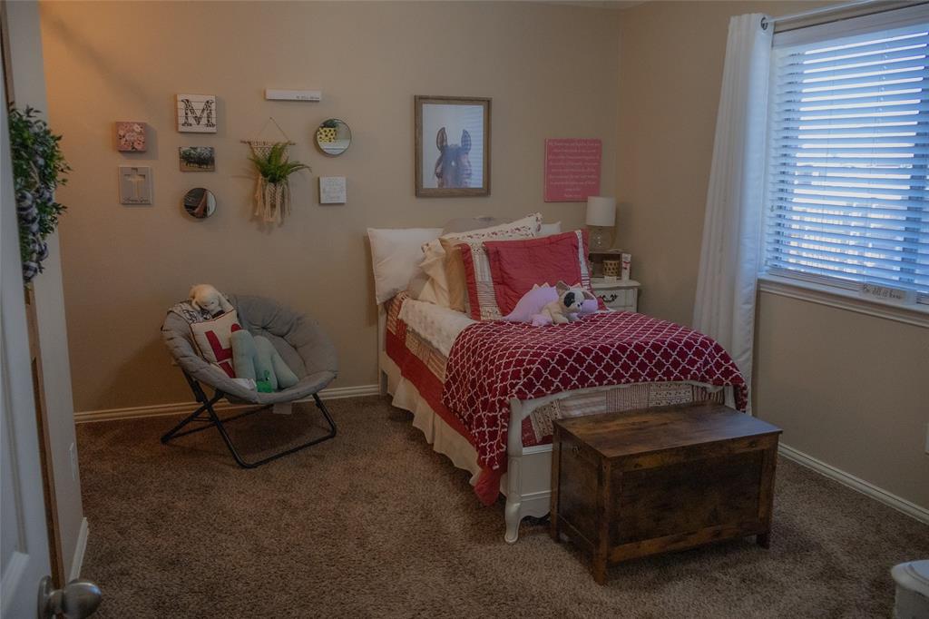 1395 Southern Rockwall, TX 75087 - Photo 16 of 22 a bedroom with a bed and window