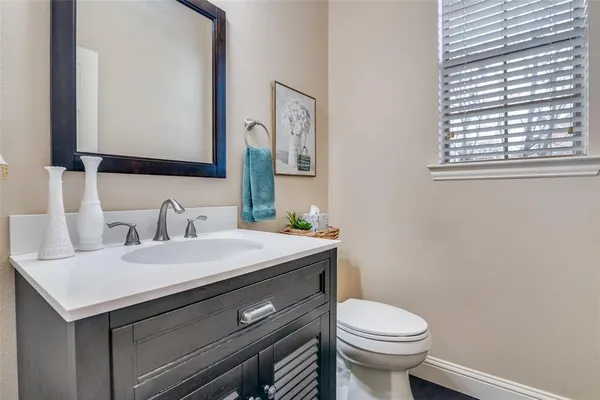 a view of a dining room with furniture and a chandelier