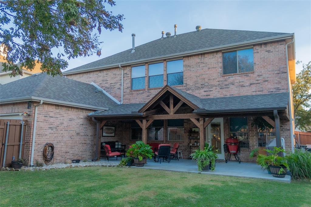 1395 Southern Rockwall, TX 75087 - Photo 20 of 22 a front view of a house with garden