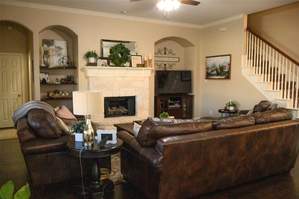 1395 Southern Rockwall, TX 75087 - Photo 4 of 22 a living room with furniture and a fireplace