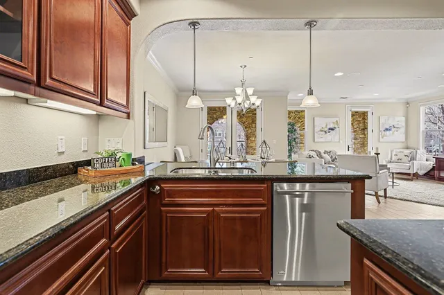 a kitchen with a sink and cabinets