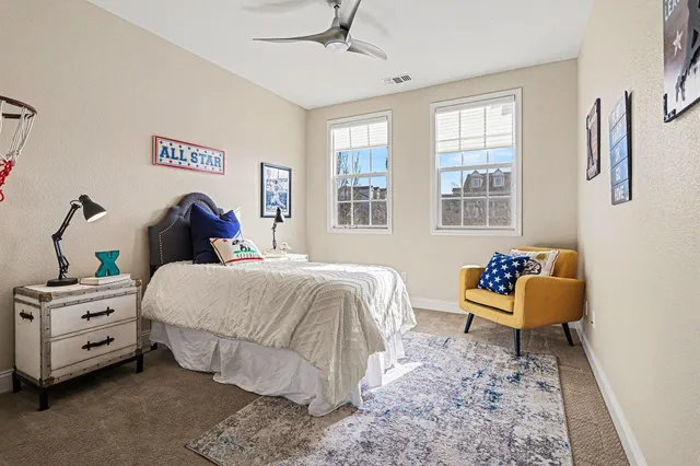 a bedroom with a bed and a couch