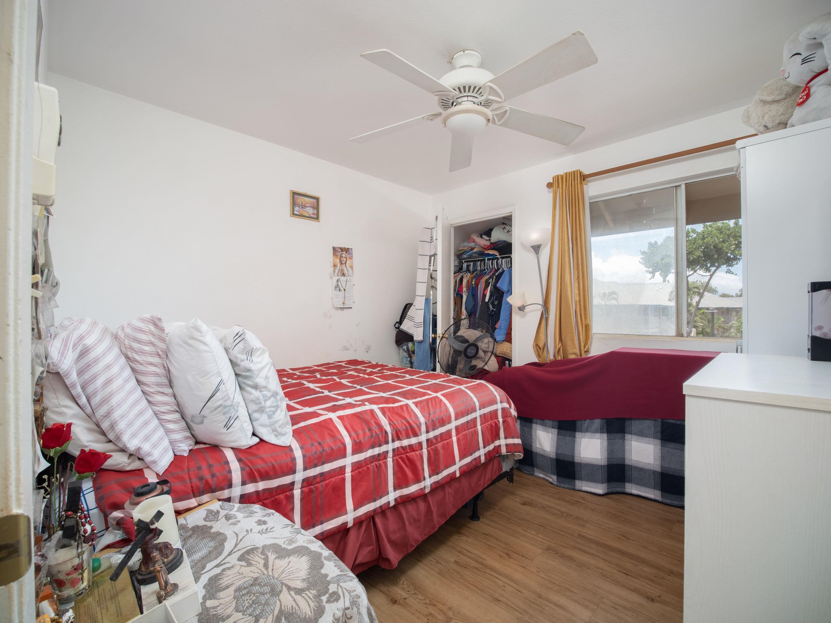 480 Kenolio Road, Unit 30206 Kihei, HI 96753 - Photo 13 of 20 a bedroom with bed and a window