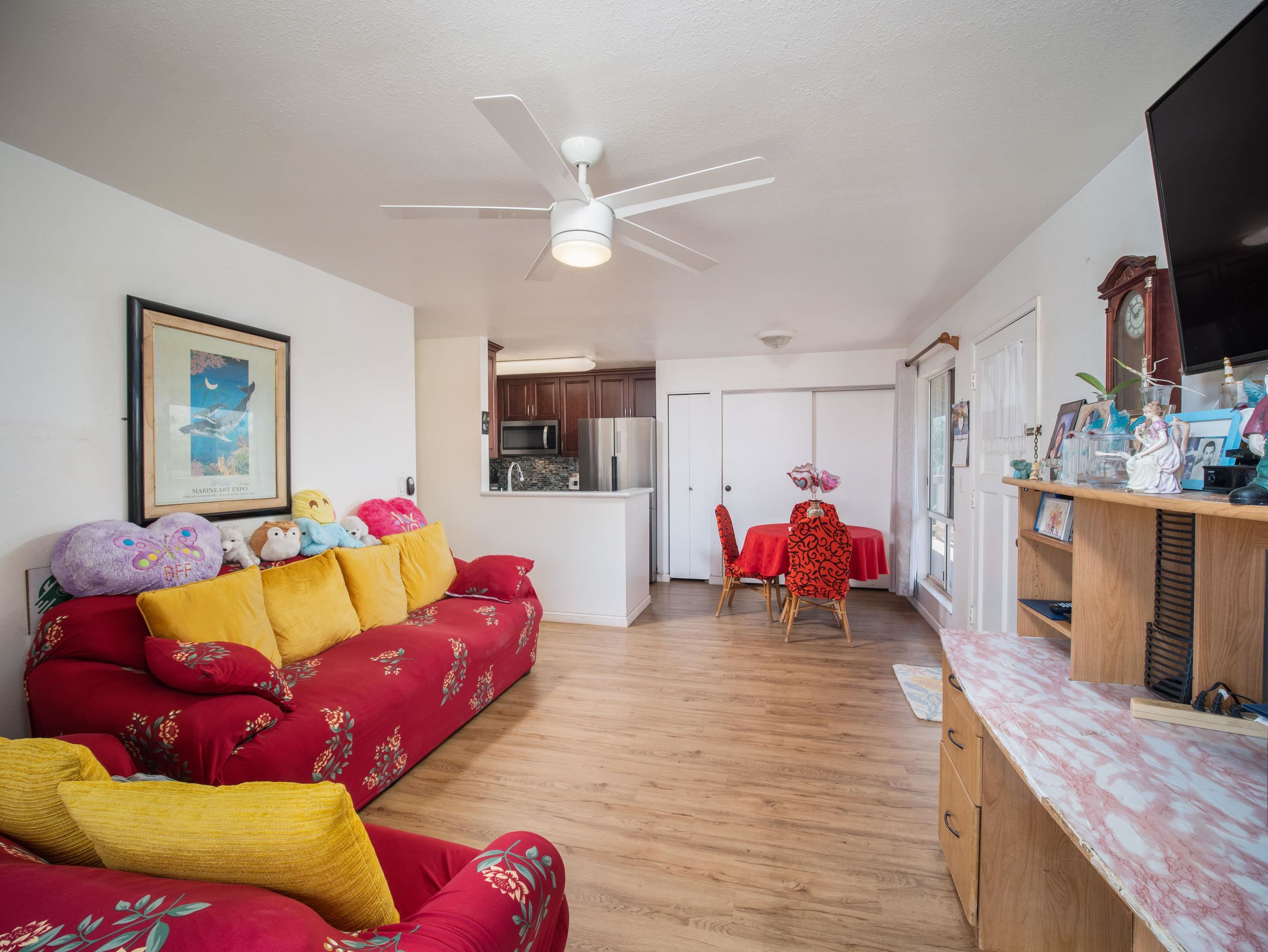 480 Kenolio Road, Unit 30206 Kihei, HI 96753 - Photo 3 of 20 a living room with furniture and a flat screen tv