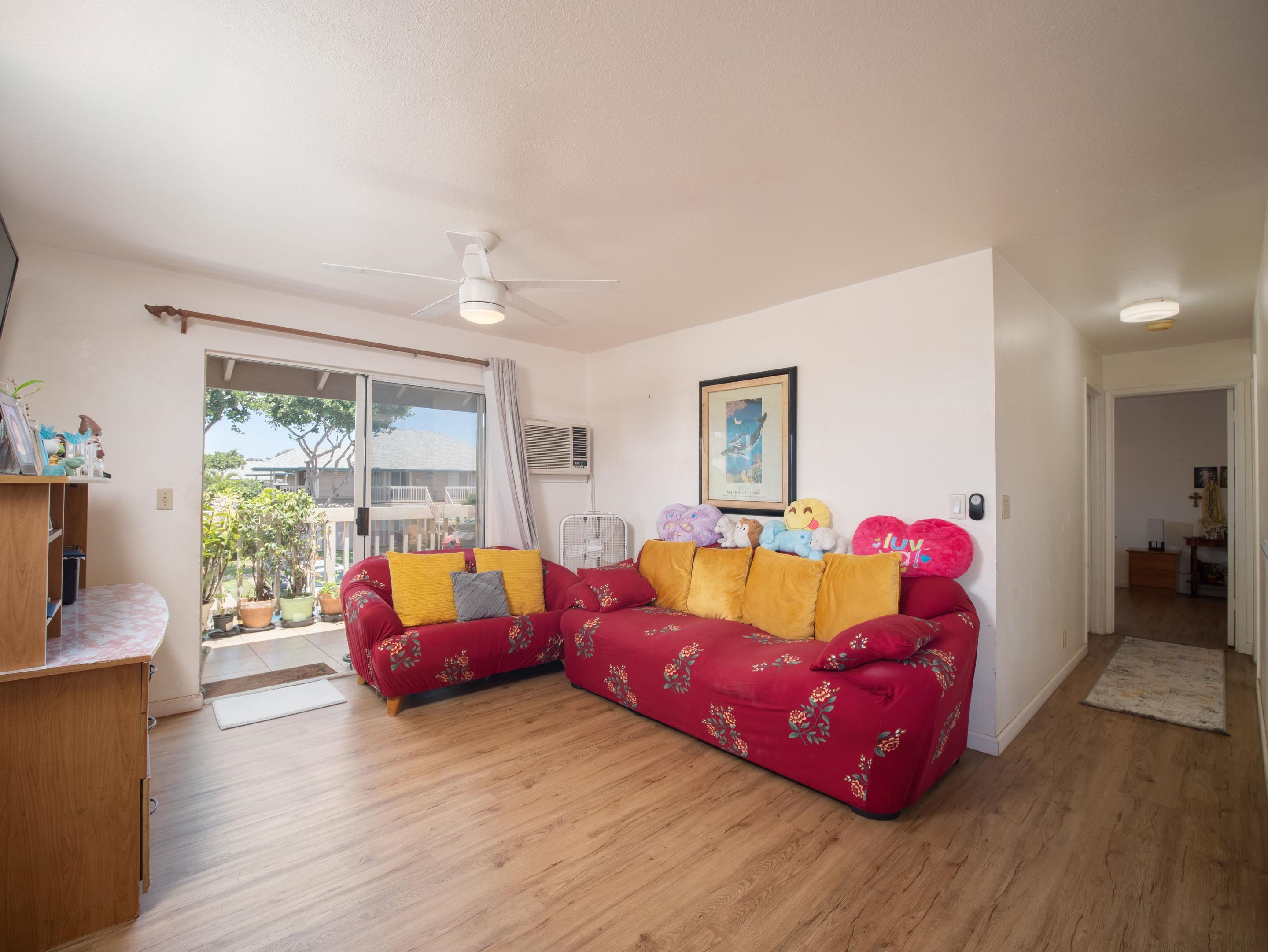 480 Kenolio Road, Unit 30206 Kihei, HI 96753 - Photo 4 of 20 a living room with furniture window and wooden floor