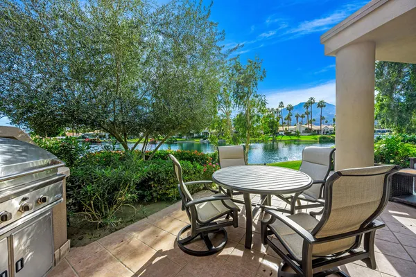 a view of a chairs and table in the patio