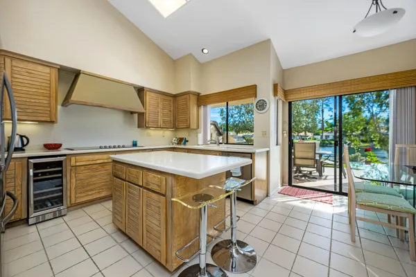 a kitchen with a stove a sink and a refrigerator
