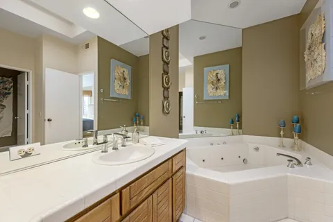 a bathroom with a shower sink double and mirror