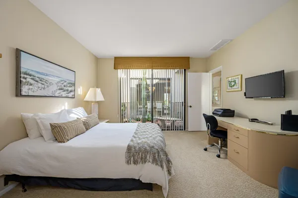 a bathroom with a shower sink and mirror