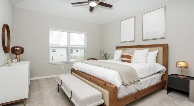 a bedroom with bed and window