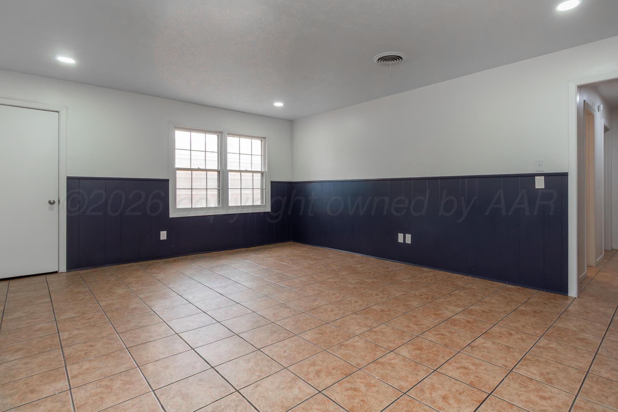 4216 Southwest 38th Avenue Amarillo, TX 79109 - Photo 11 of 19 an empty room with windows