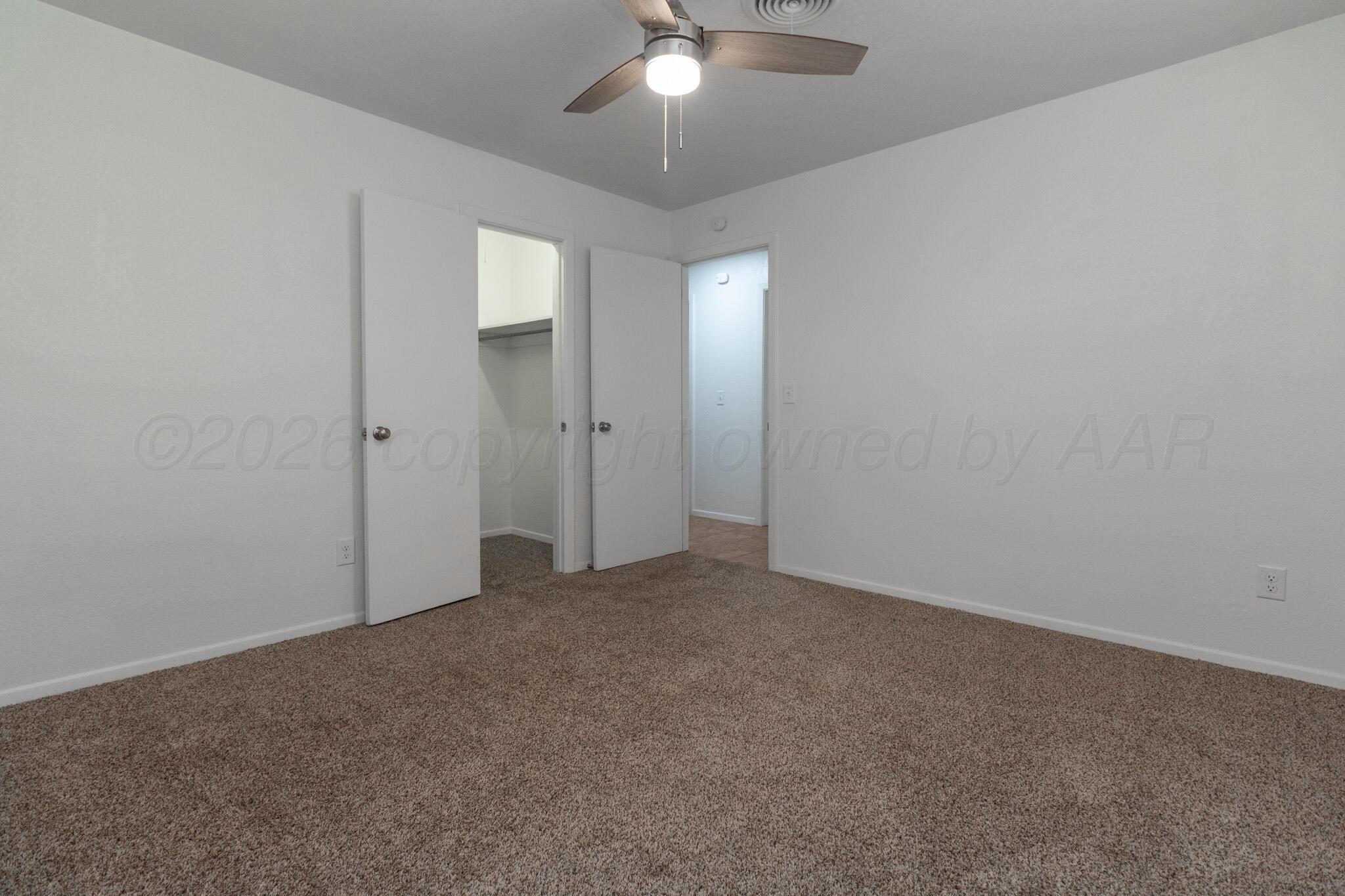 4216 Southwest 38th Avenue Amarillo, TX 79109 - Photo 15 of 19 an empty room with chandelier fan
