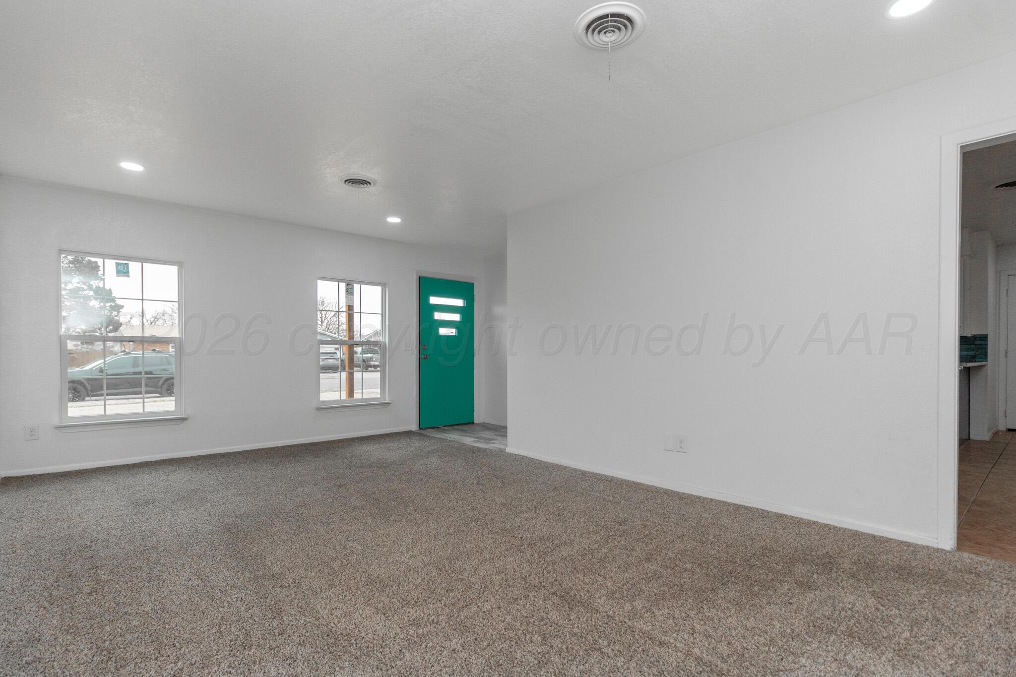 4216 Southwest 38th Avenue Amarillo, TX 79109 - Photo 2 of 19 a view of an empty room with window