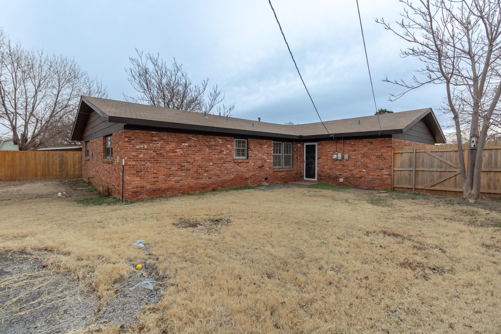 4216 Southwest 38th Avenue Amarillo, TX 79109 - Photo 3 of 19 a front view of a house with a garage