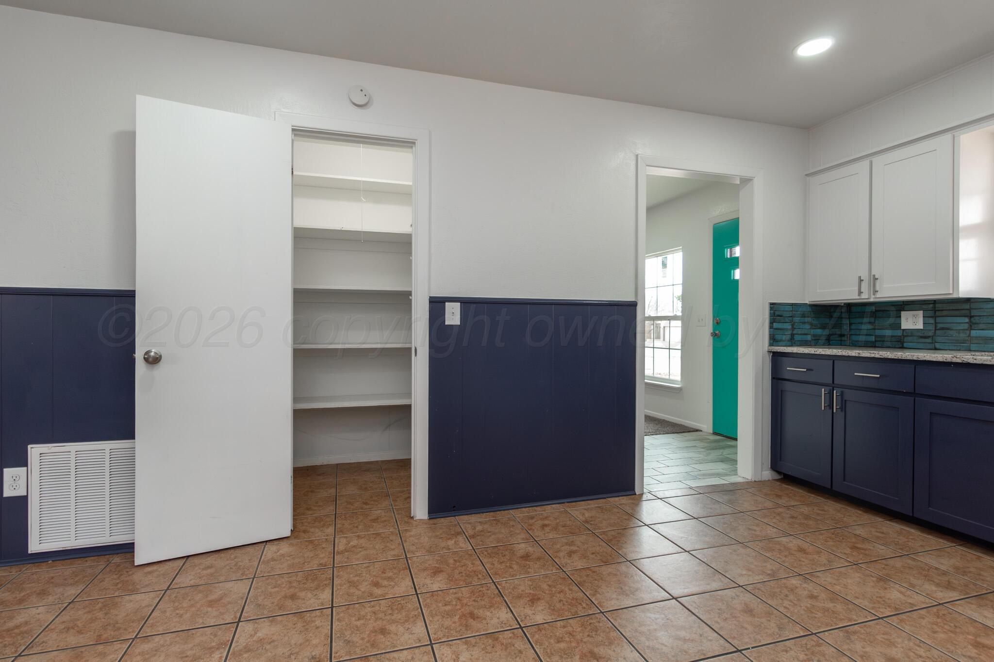 4216 Southwest 38th Avenue Amarillo, TX 79109 - Photo 7 of 19 a view of cabinets and window