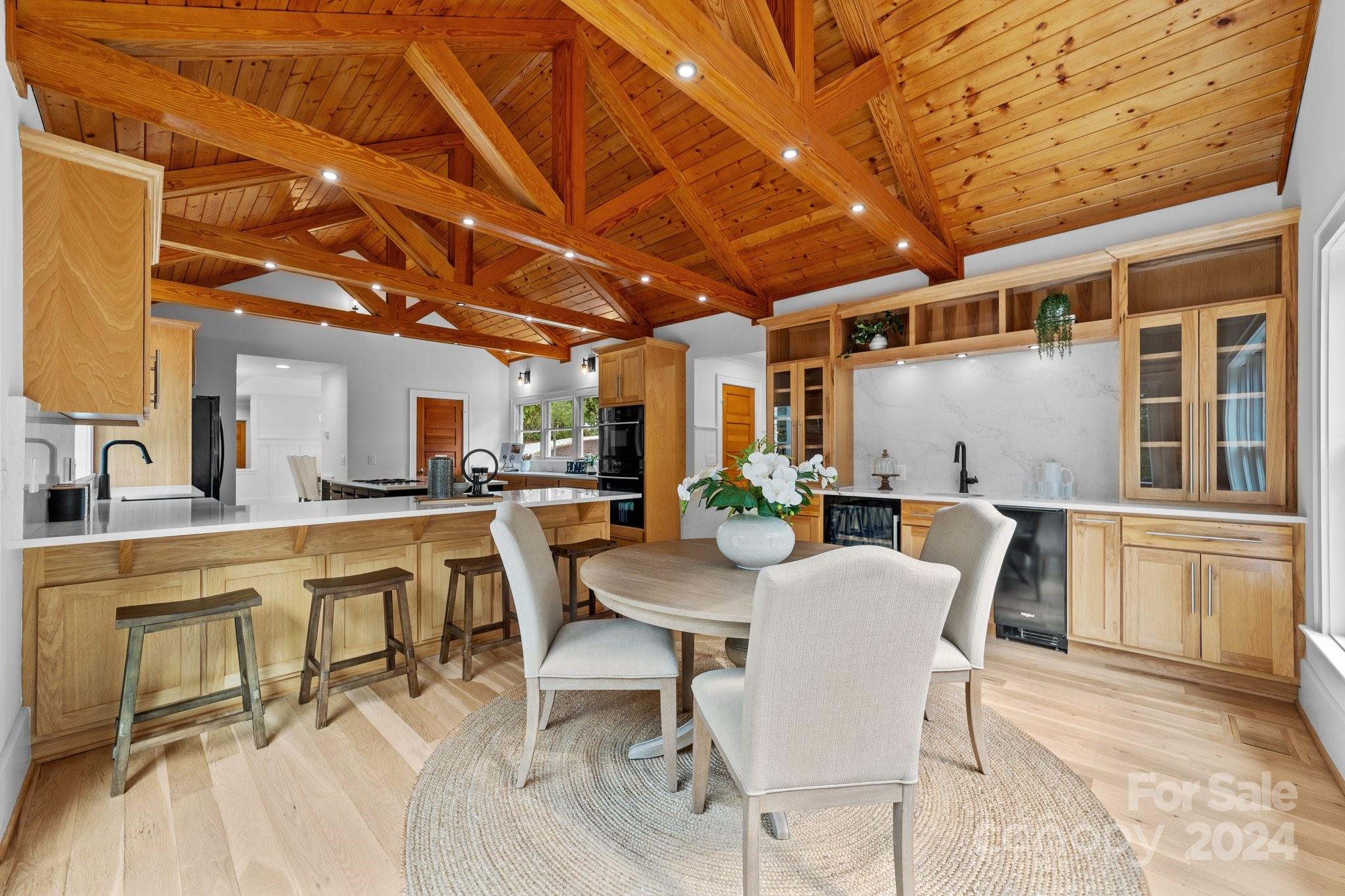 2615 Grey Road Davidson, NC 28036 - Photo 13 of 48 a view of a dining room with furniture window and wooden floor