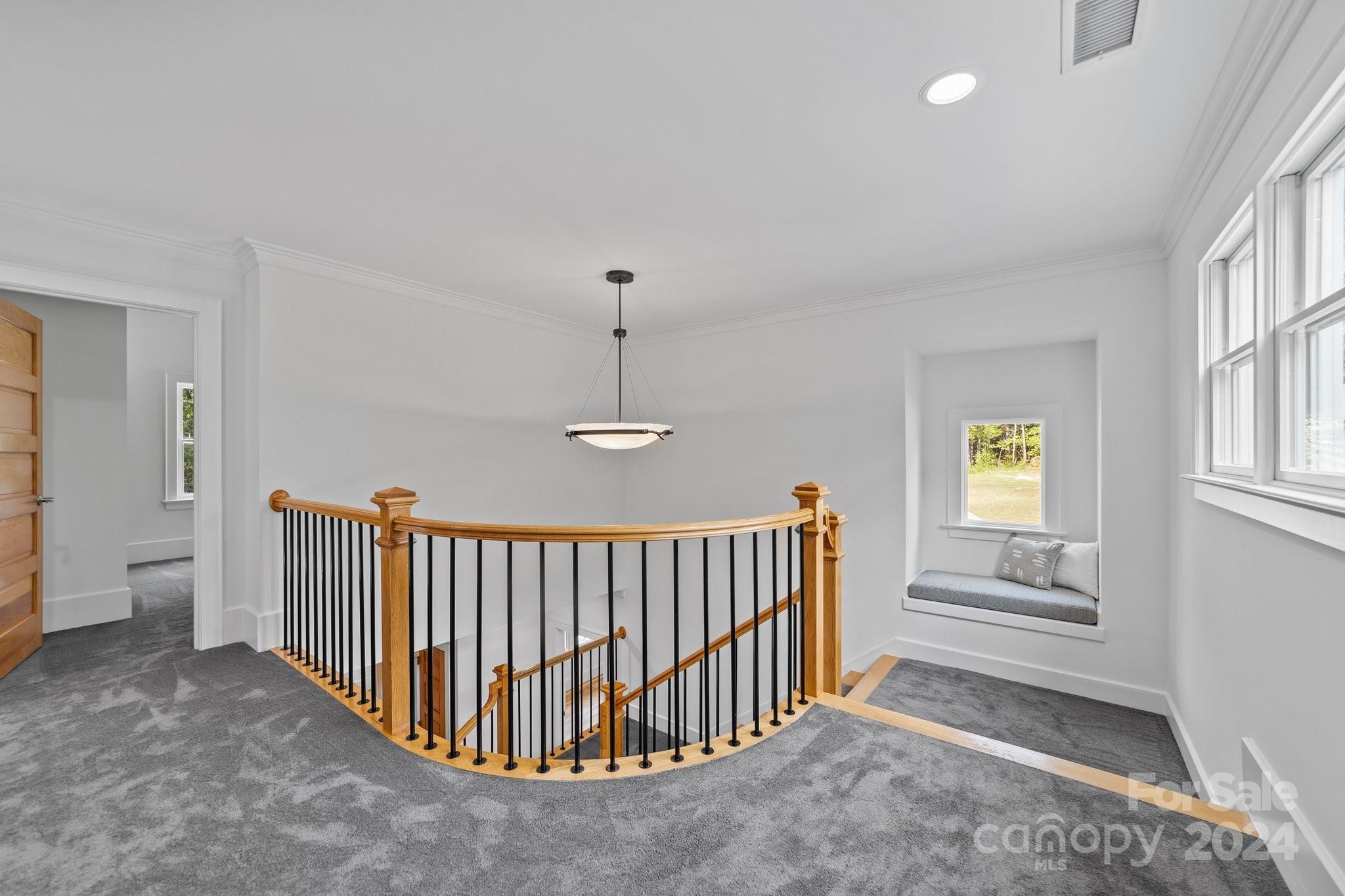 2615 Grey Road Davidson, NC 28036 - Photo 26 of 48 a view of a hallway with windows and stairs