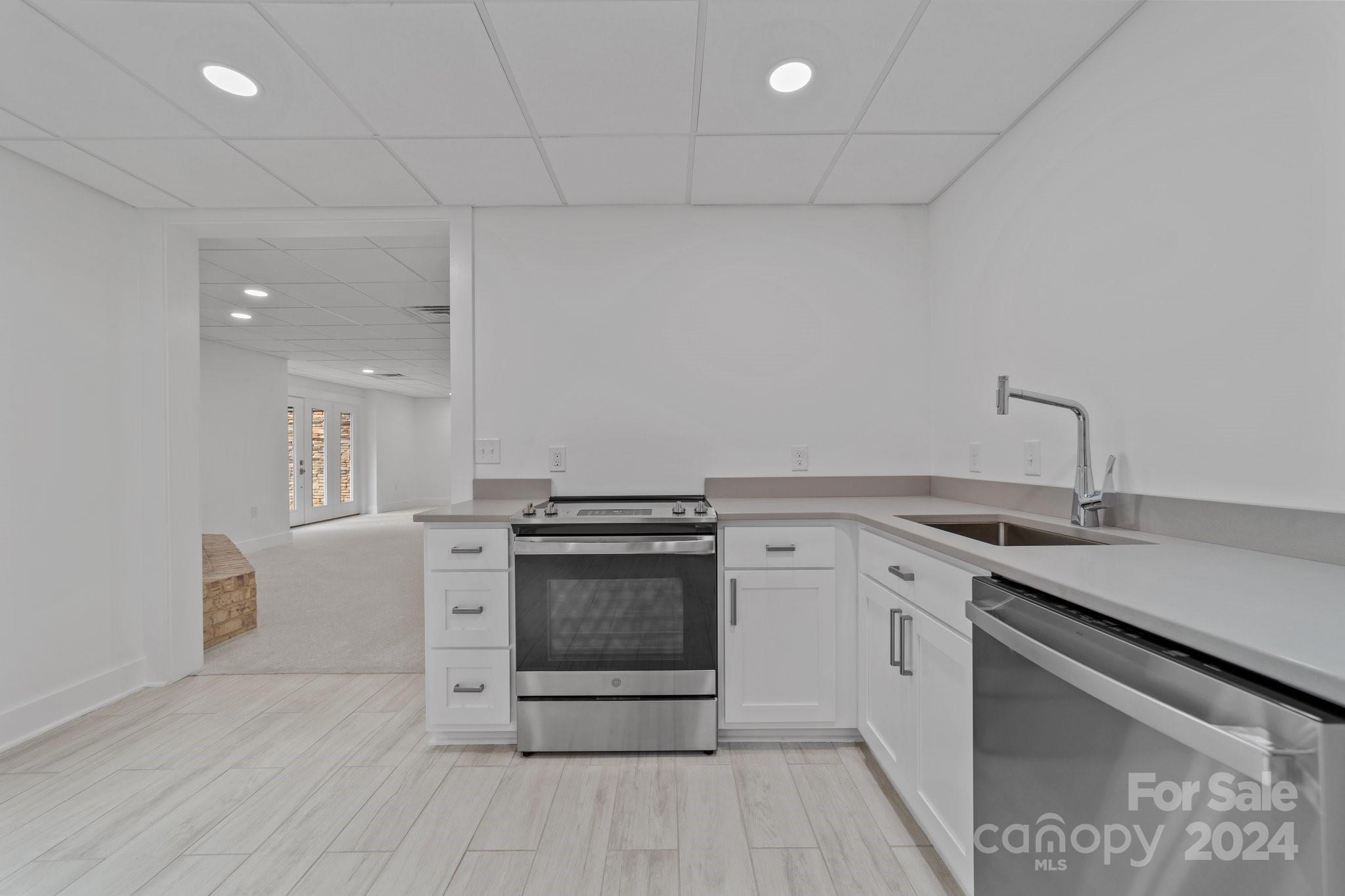 2615 Grey Road Davidson, NC 28036 - Photo 37 of 48 a kitchen with a stove and a sink