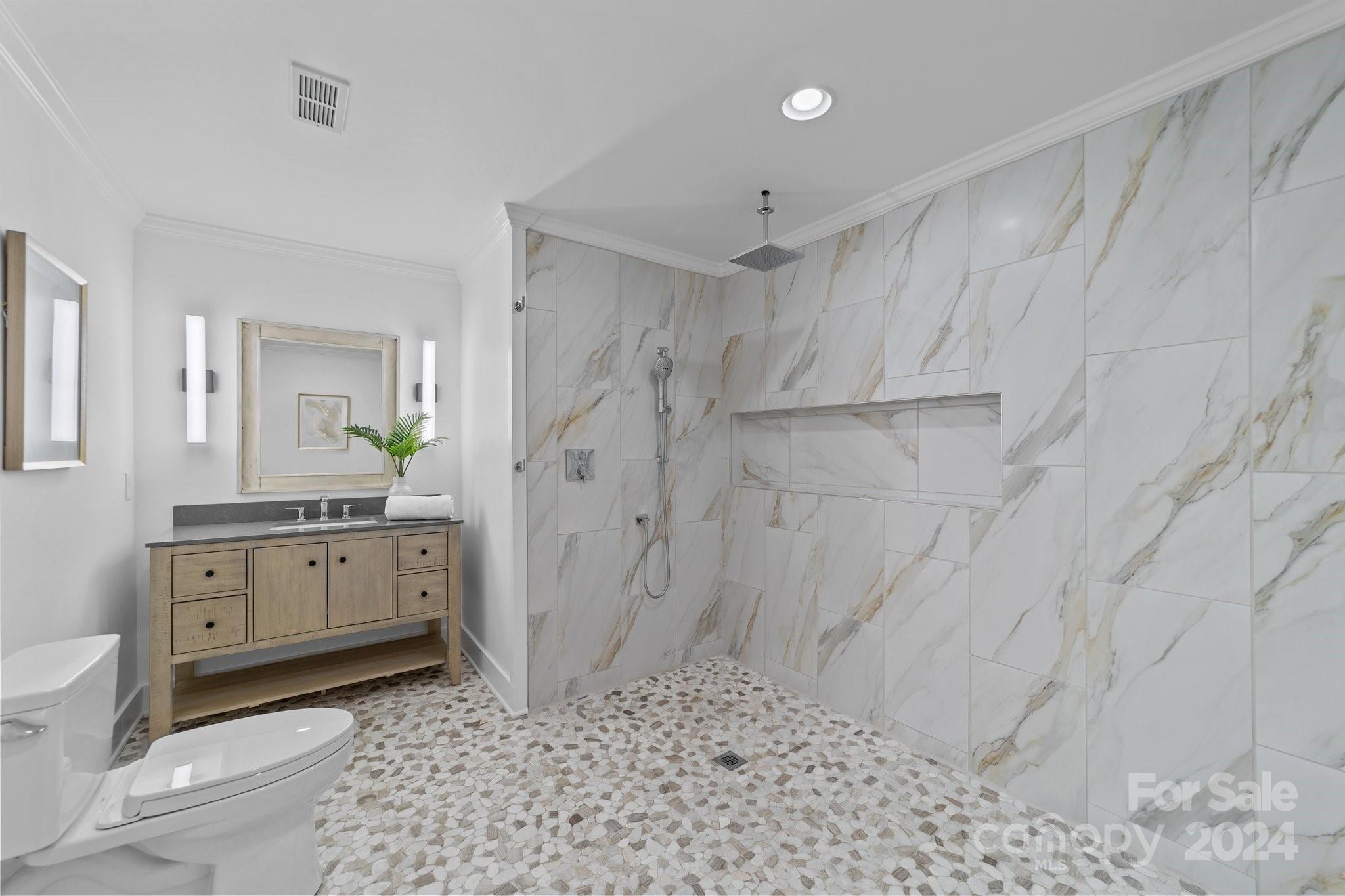 2615 Grey Road Davidson, NC 28036 - Photo 39 of 48 a bathroom with a granite countertop sink a toilet and shower
