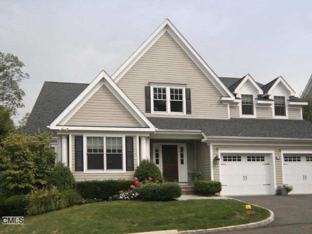 631 Long Ridge Road, Unit 50 Stamford, CT 06902 - Photo 1 of 1 a front view of a house with a yard and garage