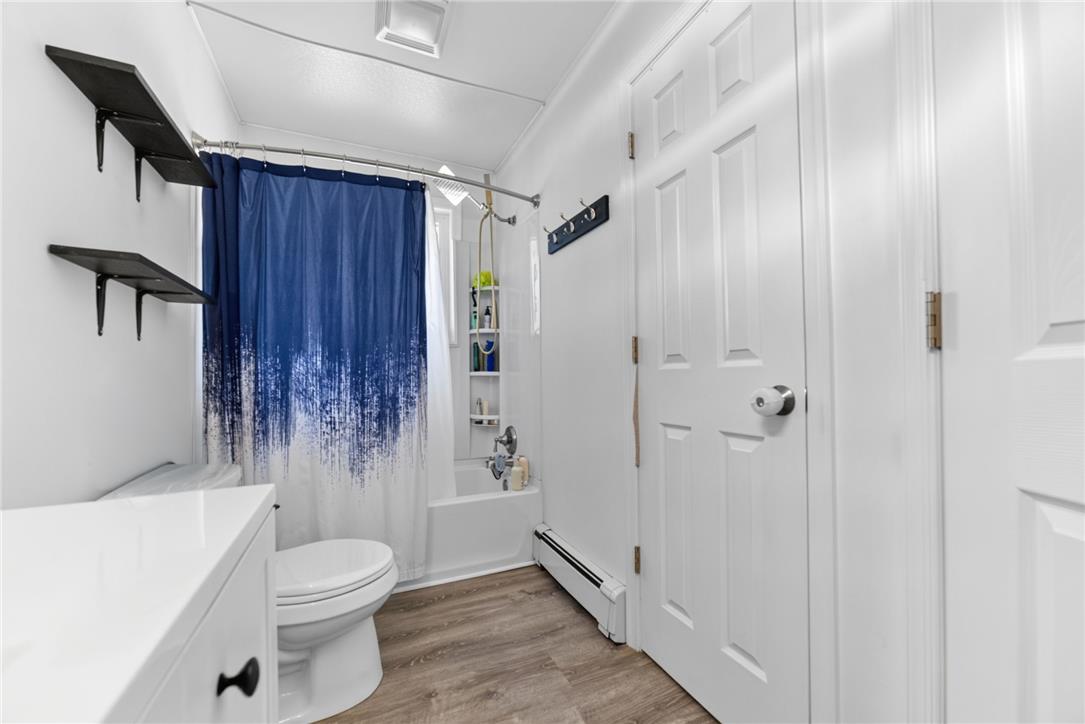 7290 Heather Road Macungie, PA 18062 - Photo 24 of 39 A pristine bathroom features durable laminate flooring and a bright, functional design.