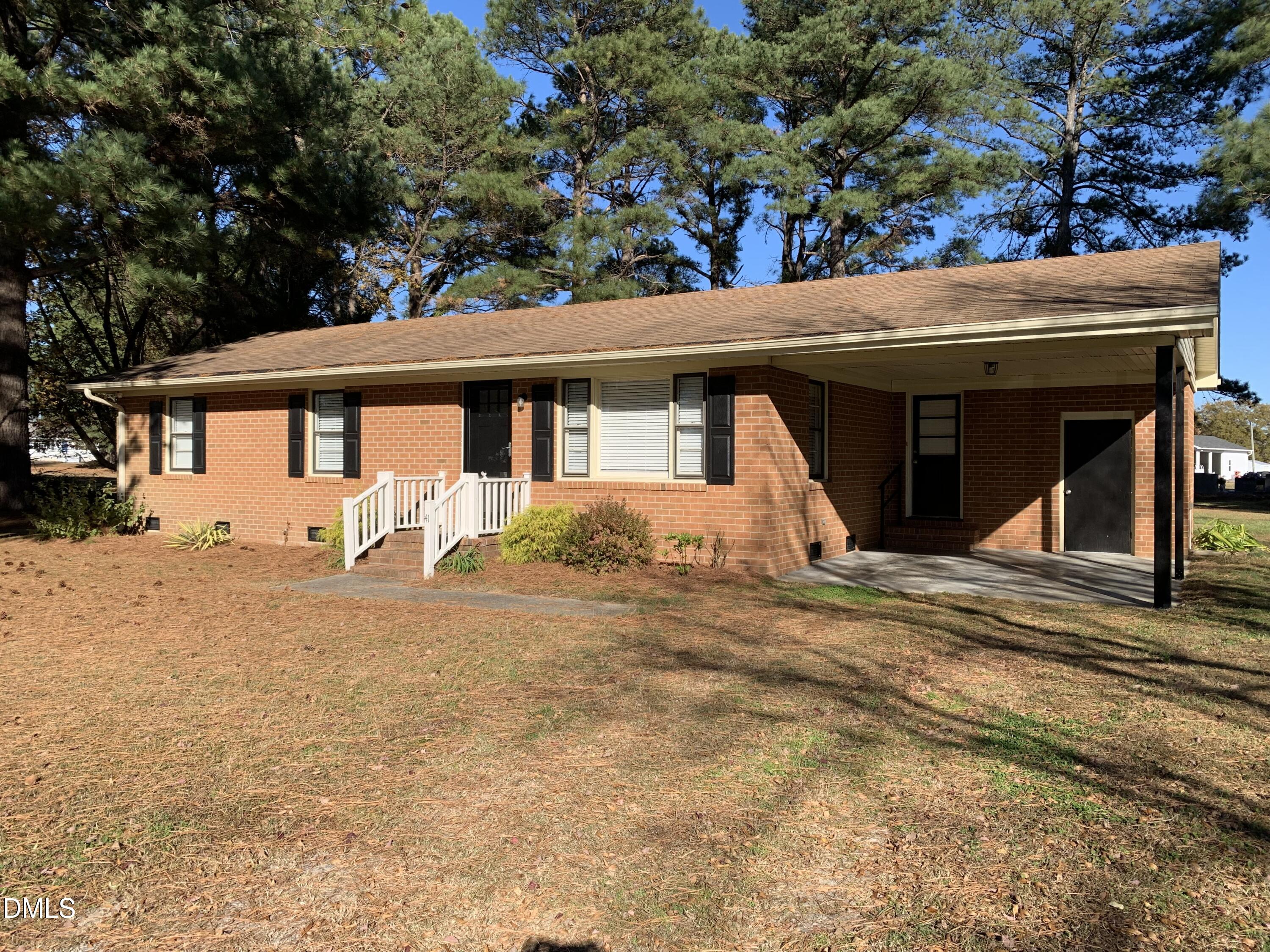 41 Tant Road Zebulon, NC 27597 - Photo 1 of 8 a view of a house with a outdoor space