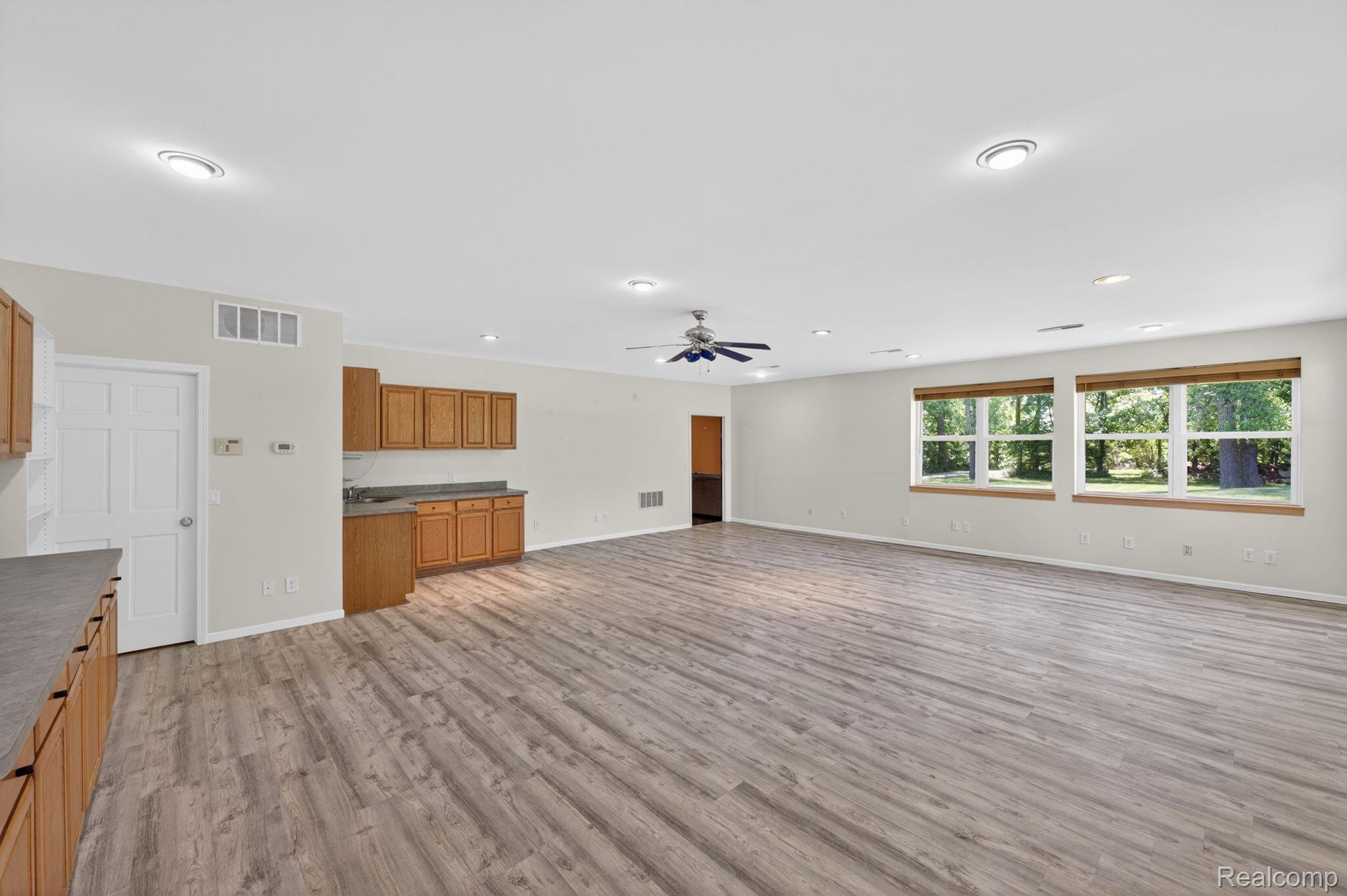 9353 Hill Road Swartz Creek, MI 48473 - Photo 79 of 98 Spacious open area featuring wood-finish flooring, recessed lighting, and a ceiling fan