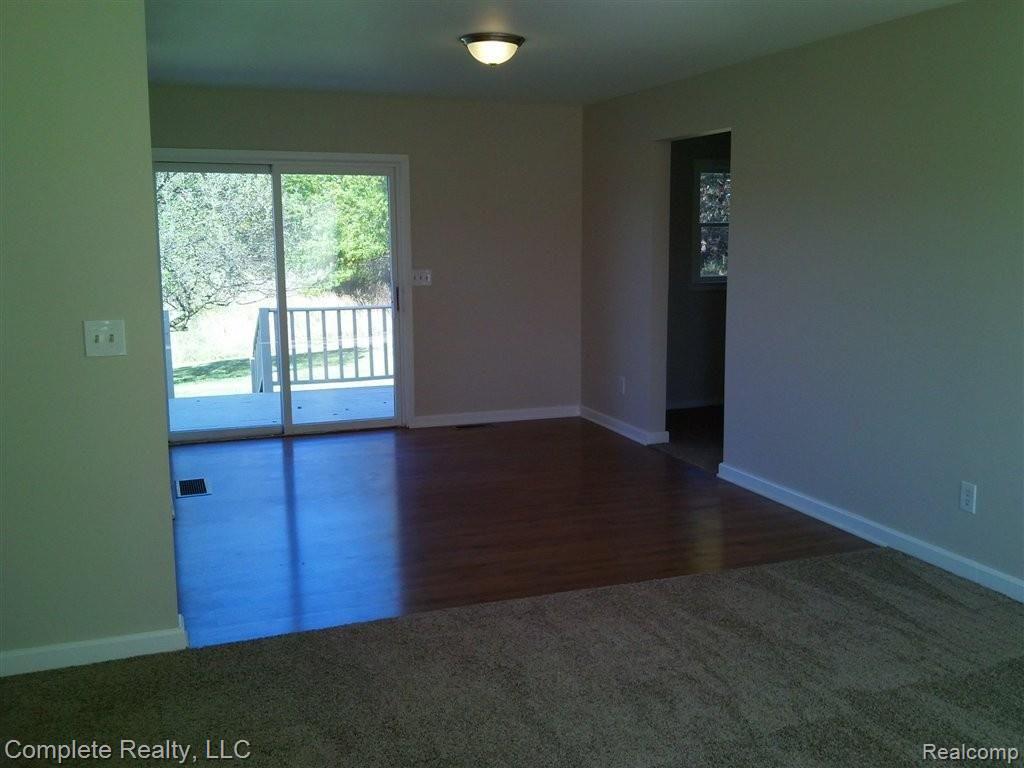 5694 West Coon Lake Road Howell, MI 48843 - Photo 3 of 13 Living to Dining