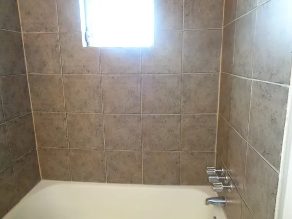 a bathroom with a bath tub