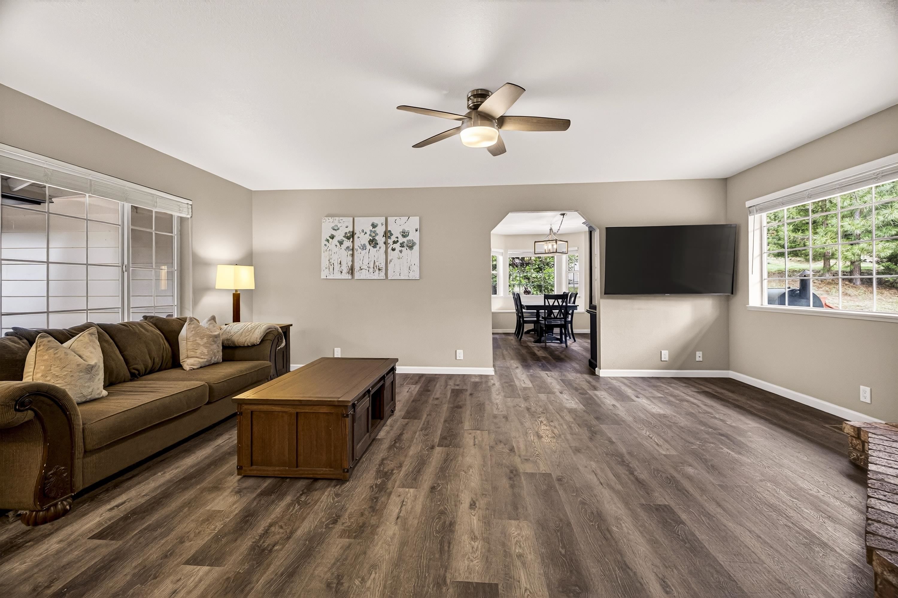 811 Golf Club Road Lake Almanor, CA 96137 - Photo 6 of 42 a living room with furniture and a flat screen tv