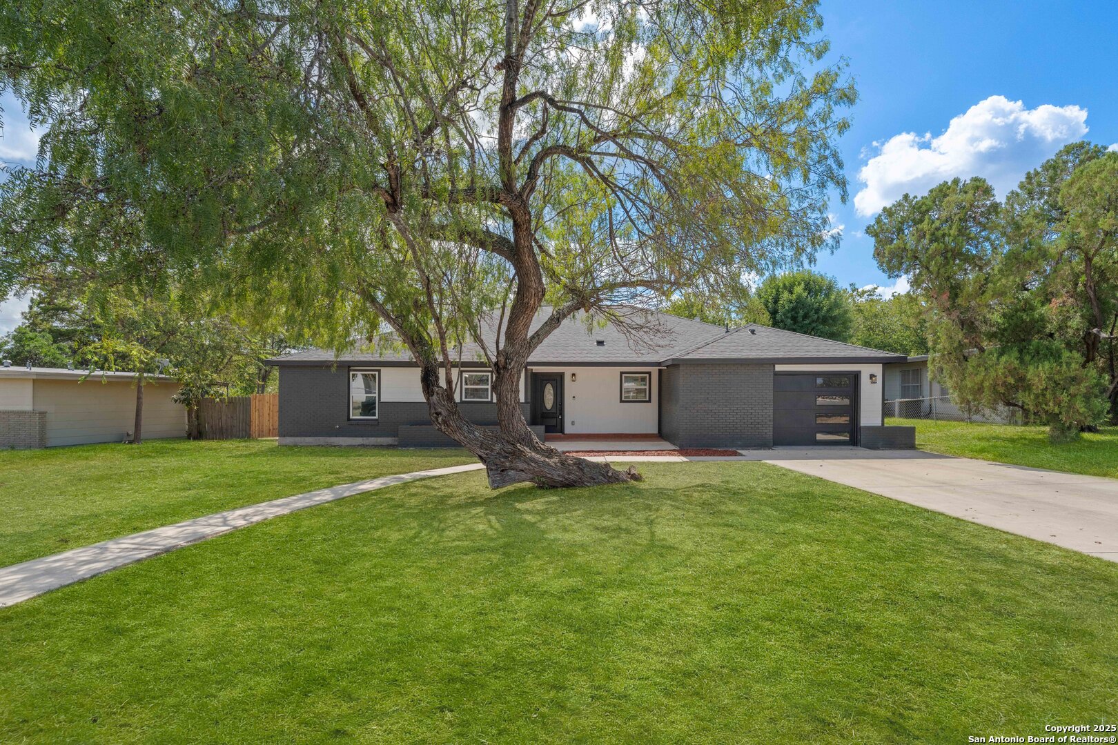 246 Sprucewood Lane San Antonio, TX 78216 - Photo 1 of 42 a house view with a sitting space and garden