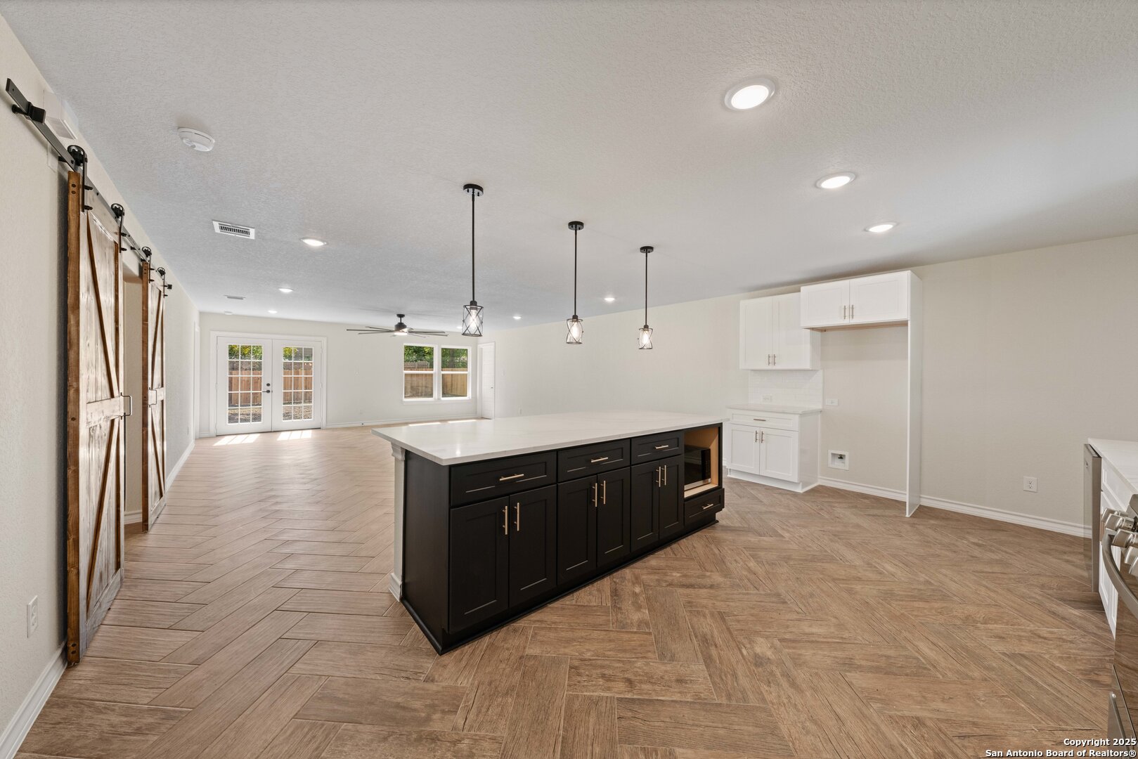 246 Sprucewood Lane San Antonio, TX 78216 - Photo 14 of 42 a large kitchen with kitchen island a sink stainless steel appliances and cabinets