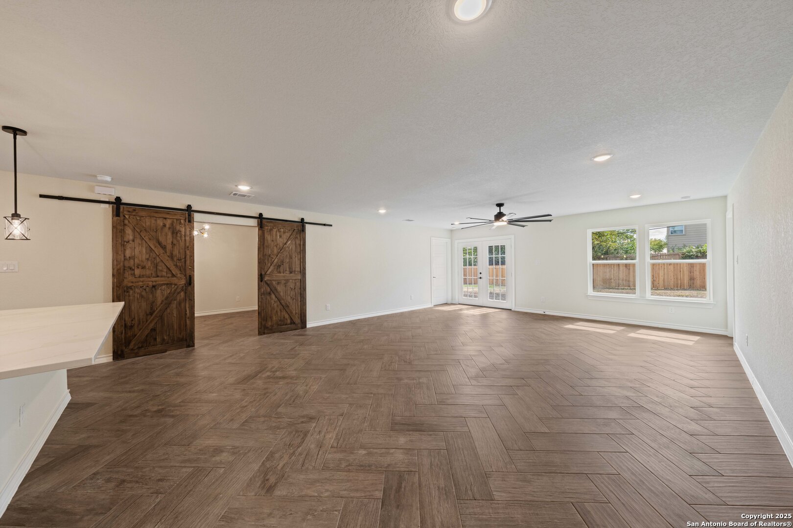 246 Sprucewood Lane San Antonio, TX 78216 - Photo 15 of 42 a view of empty room with wooden floor and fan