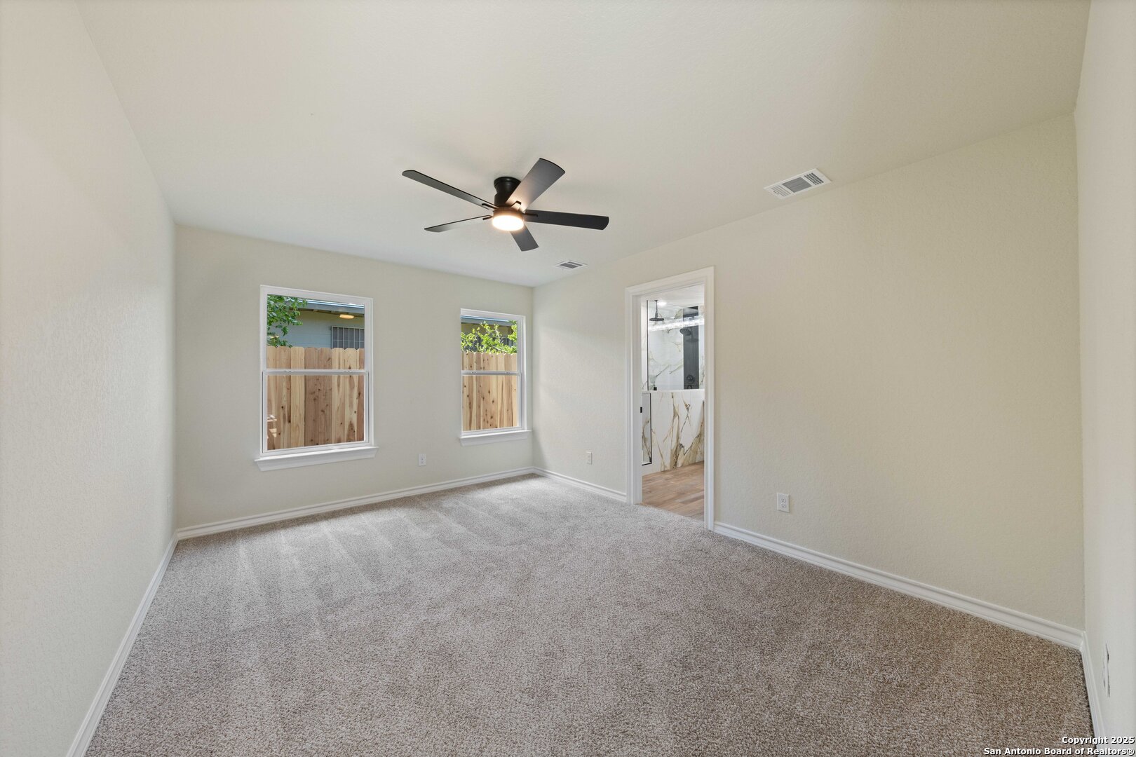 246 Sprucewood Lane San Antonio, TX 78216 - Photo 19 of 42 a view of an empty room with a window