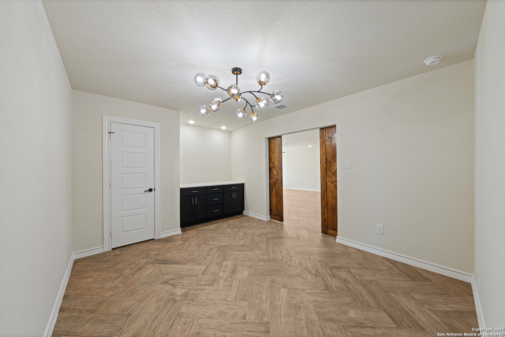 246 Sprucewood Lane San Antonio, TX 78216 - Photo 3 of 42 a view of an empty room with a chandelier fan