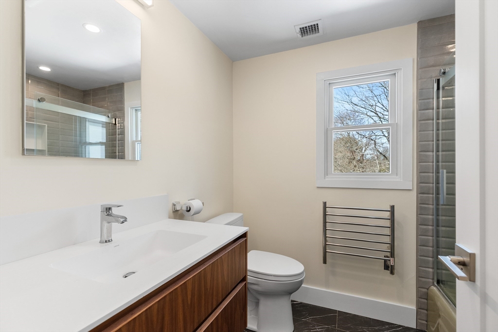 1 Maureen Road Lexington, MA 02420 - Photo 35 of 40 a bathroom with a sink a toilet and shower