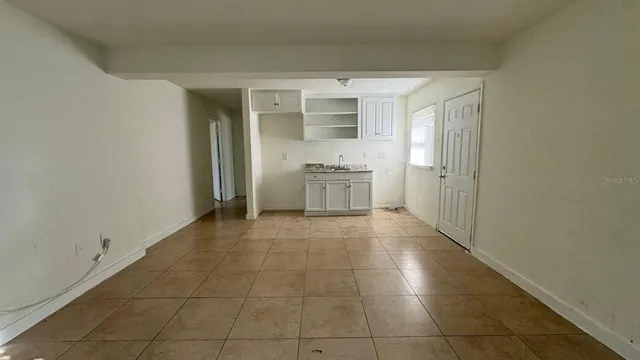 a room with a cabinets and appliances
