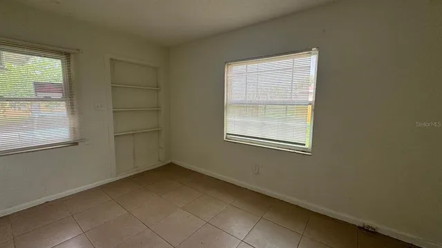 an empty room with windows