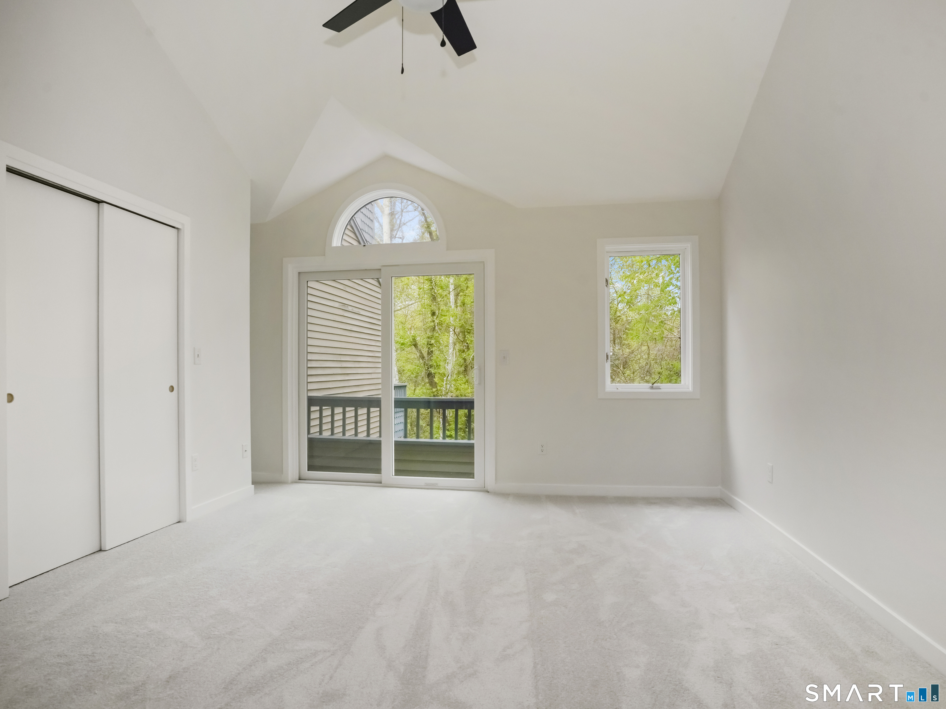 15 Perry Avenue, Unit D10 Norwalk, CT 06850 - Photo 11 of 23 an empty room with windows and entrance