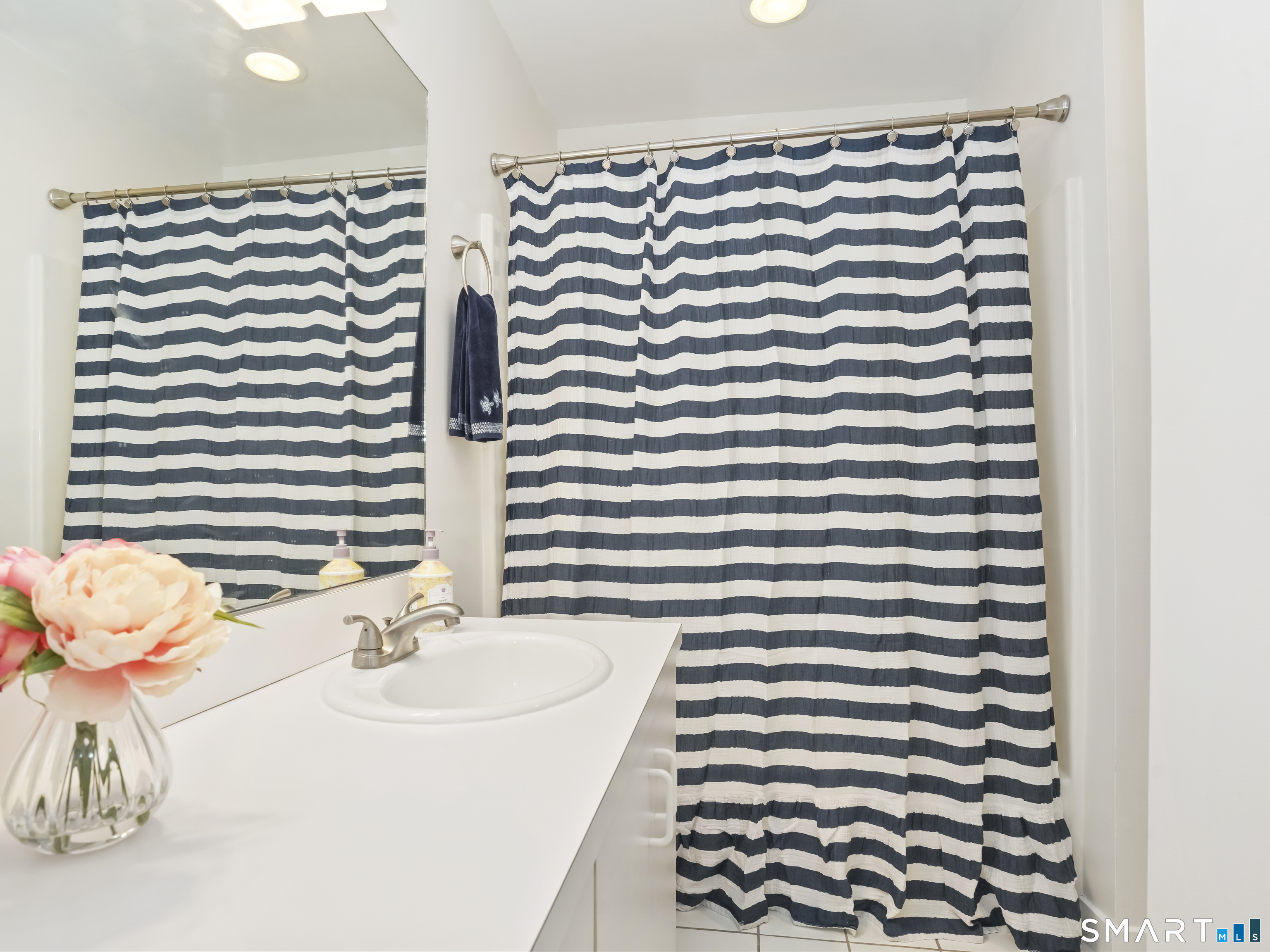 15 Perry Avenue, Unit D10 Norwalk, CT 06850 - Photo 17 of 23 a bathroom with a sink and a mirror