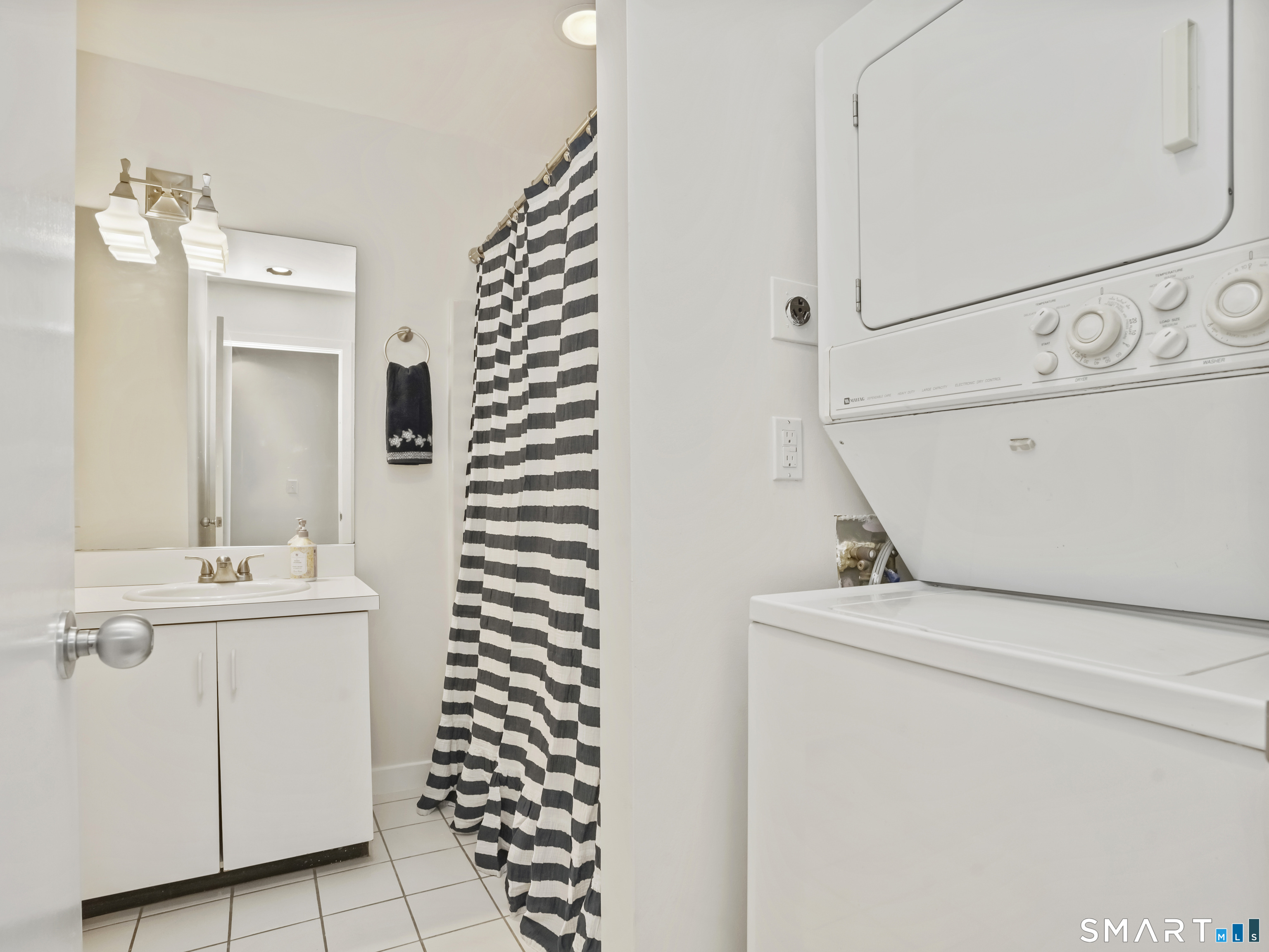 15 Perry Avenue, Unit D10 Norwalk, CT 06850 - Photo 18 of 23 a bathroom with a sink a toilet and shower
