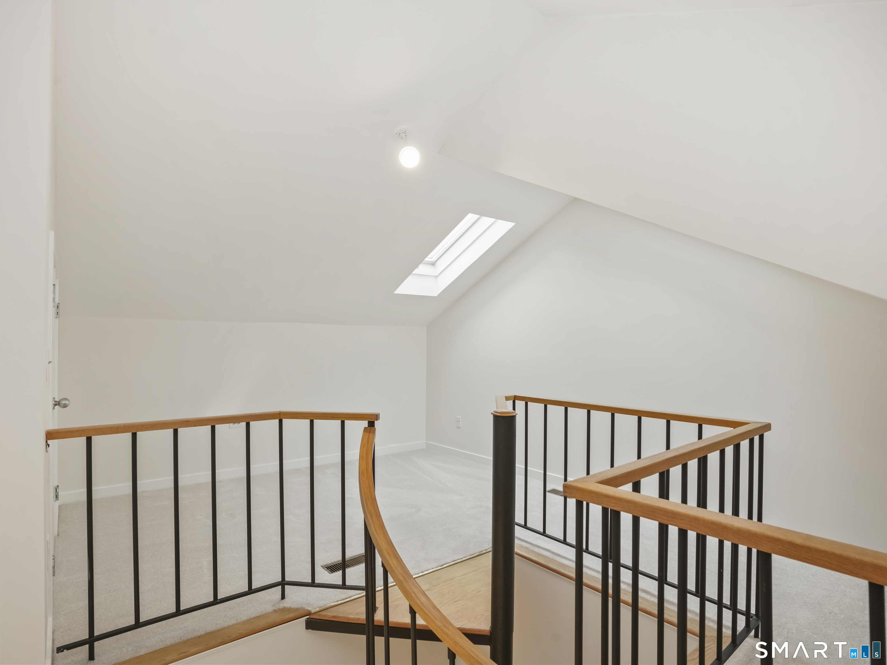 15 Perry Avenue, Unit D10 Norwalk, CT 06850 - Photo 20 of 23 a view of staircase with railing and a window
