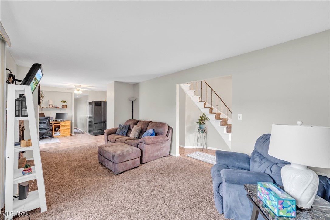 6486 State Road, Unit C5 Parma, OH 44134 - Photo 6 of 27 Living room featuring a desk, carpet floors, and stairway