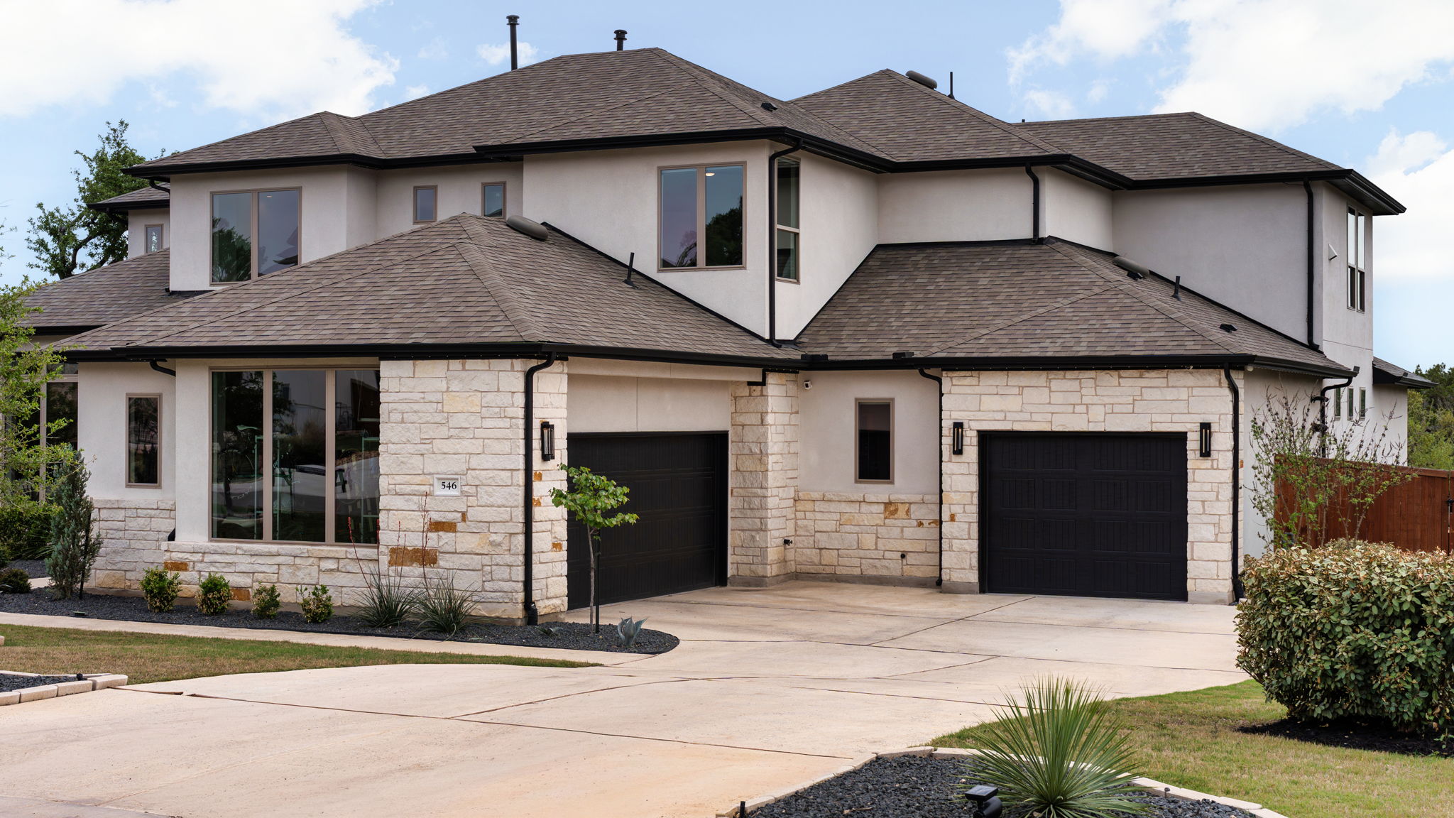 546 Bridge Water Loop Dripping Springs, TX 78620 - Photo 39 of 40 a front view of a house with a yard and garage